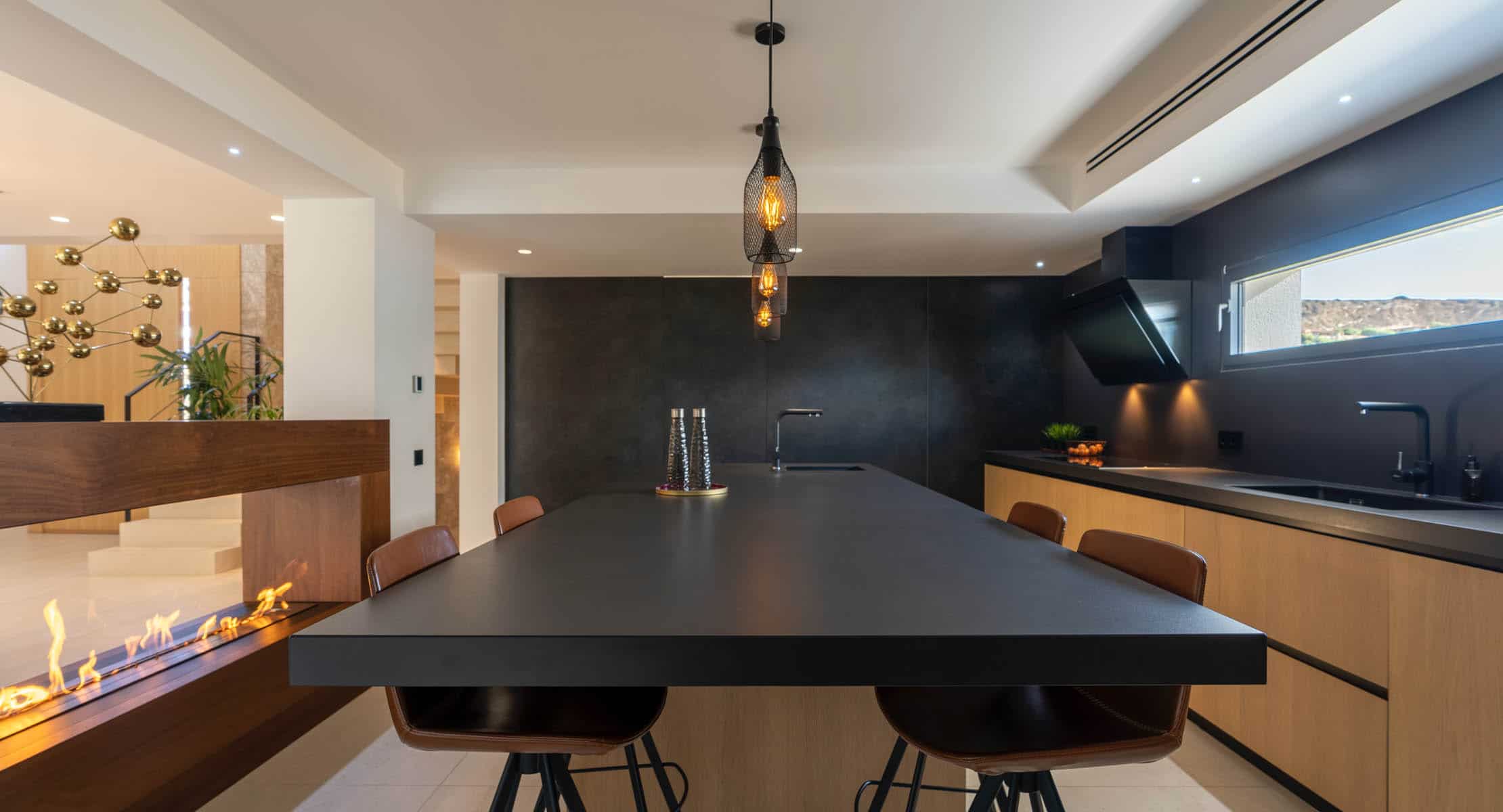 Image of cocinas 02 header in Kitchen table and wall cladding in the same material - Cosentino