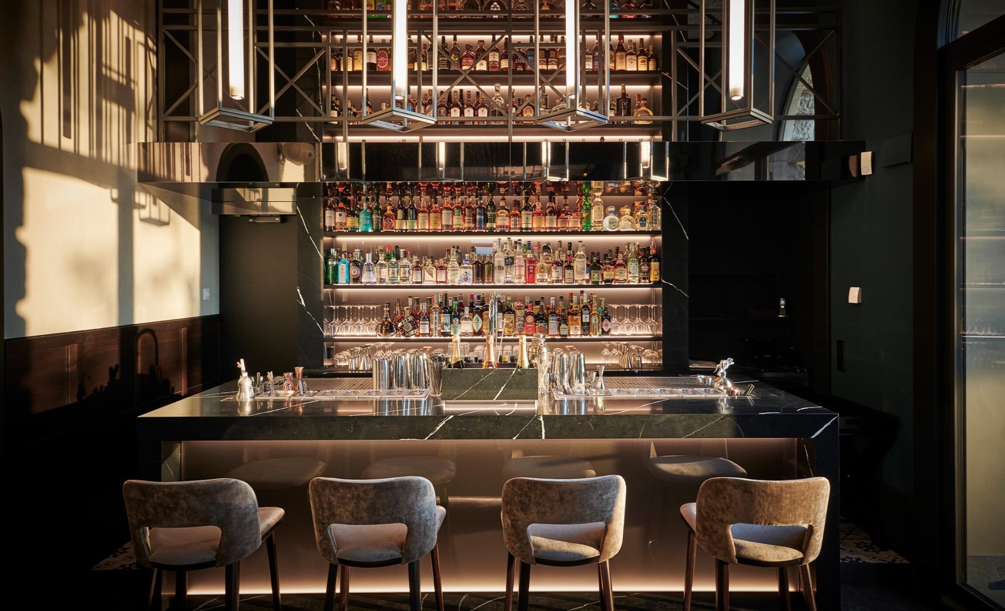 Image 25 of bar am wasser referenz QUER kueng schreinerei emmen 28 in The bold black of Silestone Et Marquina for one of Switzerland’s most awarded (and beautiful) bars  - Cosentino
